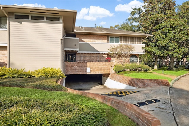 exterior space featuring brick siding