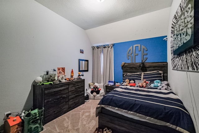 bedroom featuring lofted ceiling and carpet floors