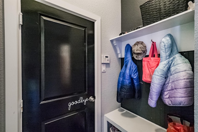 mudroom with a textured wall