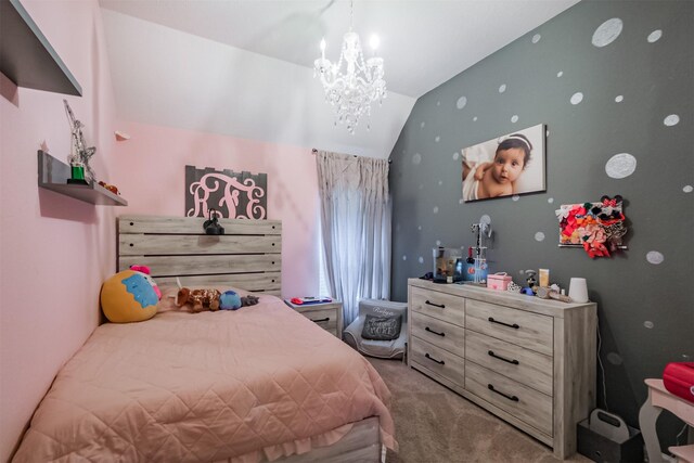 bedroom featuring lofted ceiling, carpet floors, and a notable chandelier