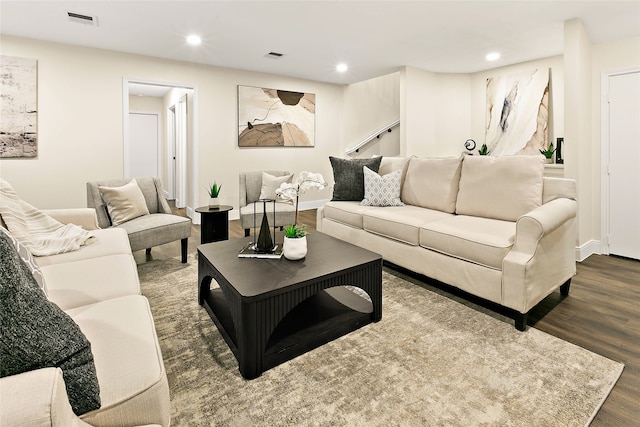 living area with visible vents, wood finished floors, stairway, and recessed lighting