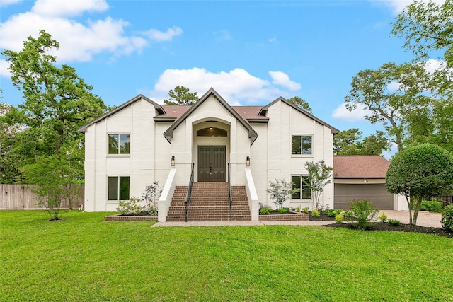 modern farmhouse style home with a garage, fence, a front lawn, brick siding, and roof with shingles