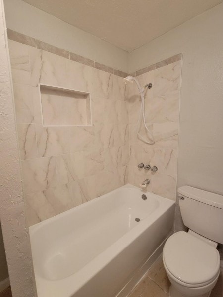 bathroom featuring toilet and shower / washtub combination