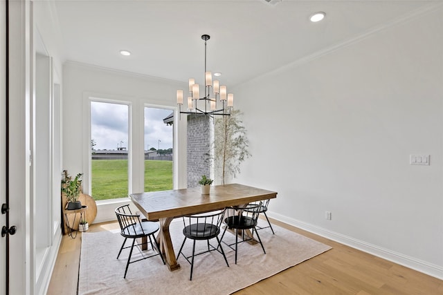 4233 Padova Cir, College Station, TX 77845 - dining area with a notable chandelier, recessed lighting, baseboards, ornamental molding, and light wood-type flooring