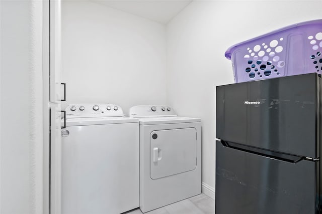 4233 Padova Cir, College Station, TX 77845 - laundry area with laundry area, light tile patterned floors, and washer and dryer