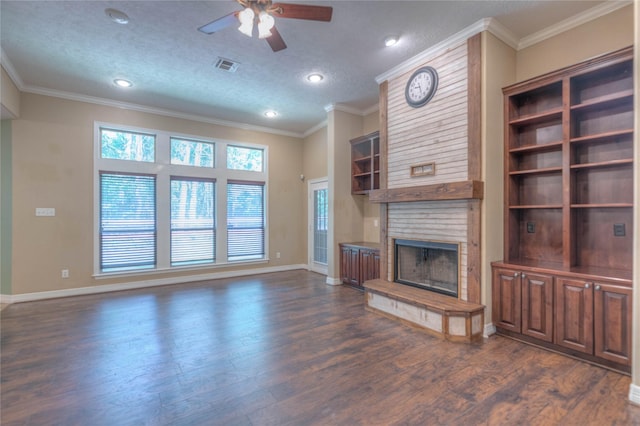 unfurnished living room with a fireplace, visible vents, baseboards, ceiling fan, and dark wood-style floors
