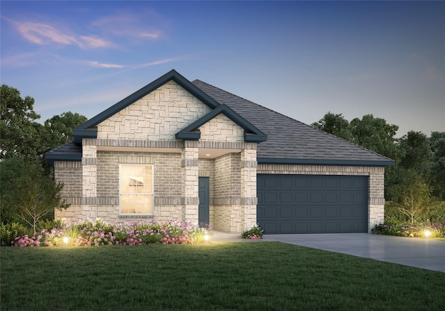 view of front of home featuring driveway, brick siding, a garage, stone siding, and a front lawn