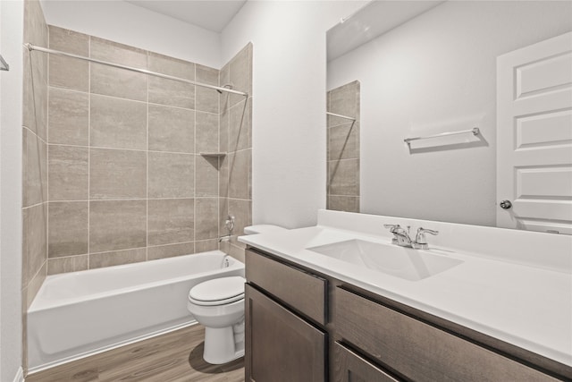 full bath with vanity, toilet, wood finished floors, and bathtub / shower combination
