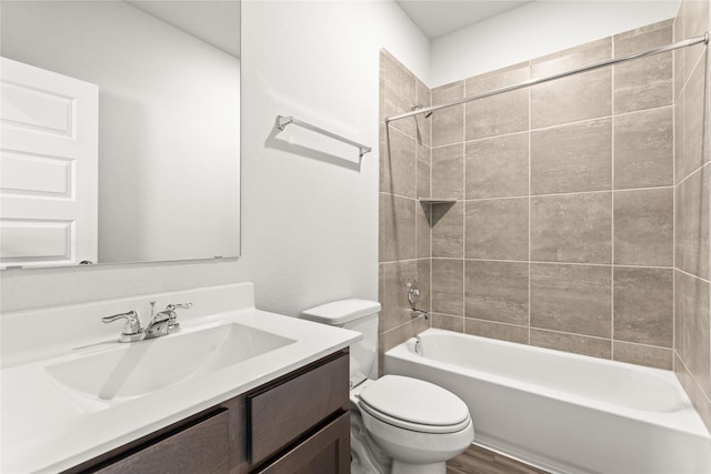 bathroom with toilet, vanity, bathtub / shower combination, and wood finished floors