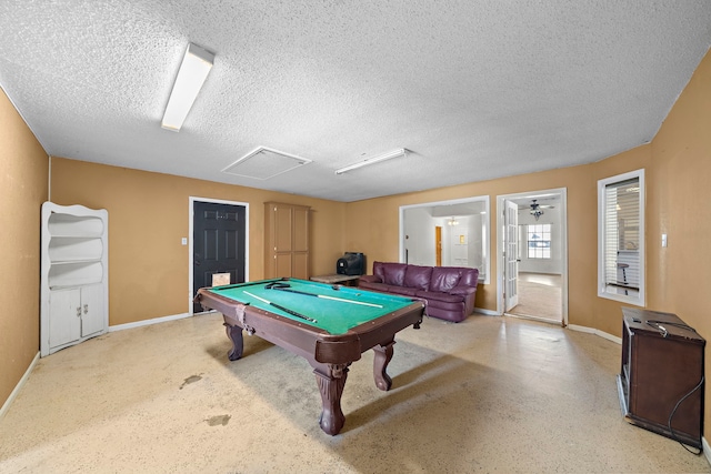 7009 Ave Ave N, Santa Fe, TX 77510 - recreation room with baseboards, pool table, and a textured ceiling