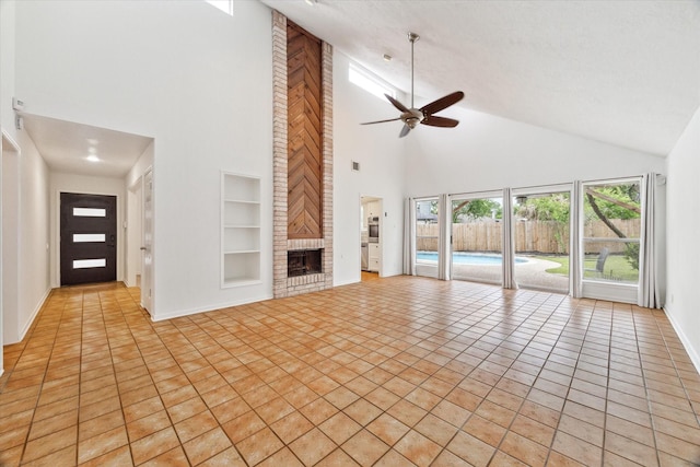 unfurnished living room featuring a fireplace, high vaulted ceiling, a ceiling fan, and built in features