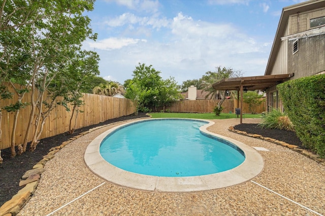 view of swimming pool with a fenced in pool and a fenced backyard