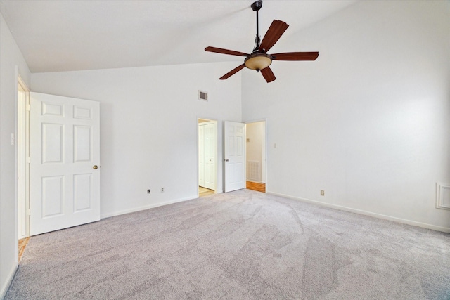 unfurnished bedroom with light carpet, baseboards, high vaulted ceiling, and visible vents