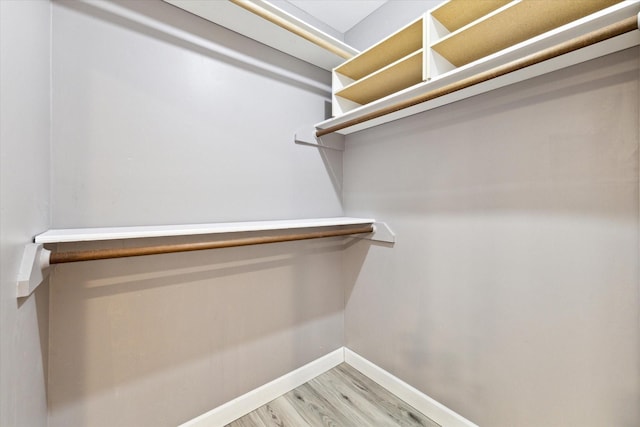 spacious closet with wood finished floors