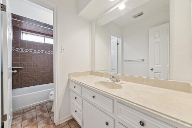 bathroom with toilet, visible vents, tile patterned flooring, vanity, and bathing tub / shower combination