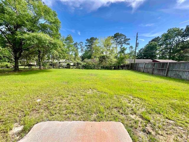 view of yard with fence