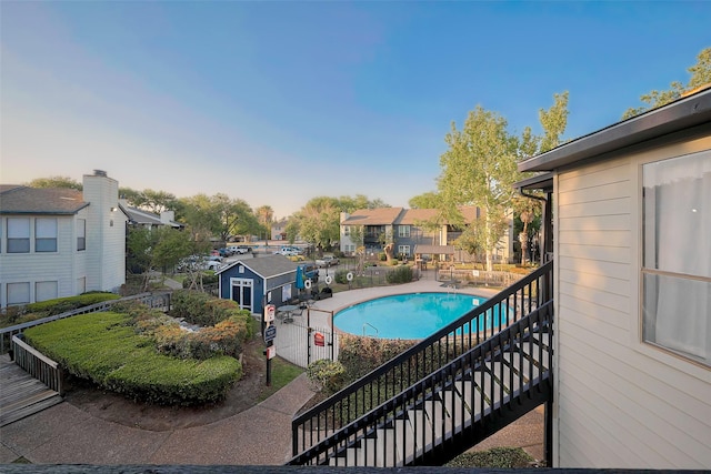 9009 Richmond Ave Unit 613, Houston, TX 77063 - view of swimming pool with a residential view and stairway