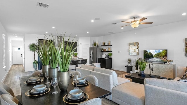 3119 Crown Gate Dr, Houston, TX 77047 - dining space with a ceiling fan, light wood-style flooring, recessed lighting, baseboards, and visible vents