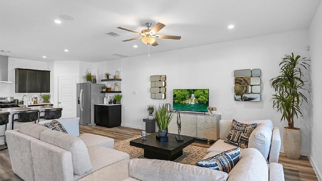 3119 Crown Gate Dr, Houston, TX 77047 - living area with recessed lighting, visible vents, and wood finished floors