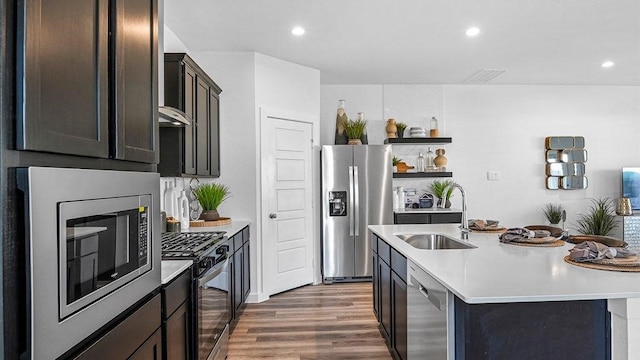 3119 Crown Gate Dr, Houston, TX 77047 - kitchen with a sink, stainless steel appliances, light countertops, and wood finished floors