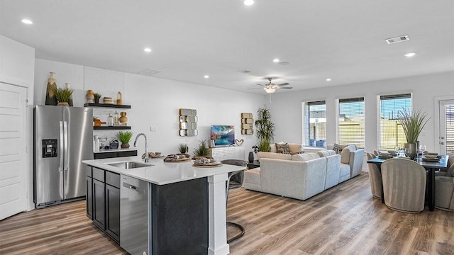 3119 Crown Gate Dr, Houston, TX 77047 - kitchen featuring a ceiling fan, visible vents, a sink, light countertops, and appliances with stainless steel finishes