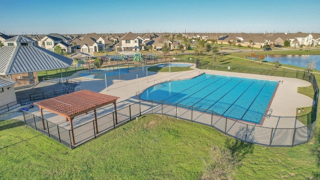 6126 Severson Lk, Katy, TX 77493 - community pool with fence, a residential view, and a lawn