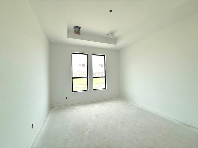 6126 Severson Lk, Katy, TX 77493 - unfurnished room featuring a tray ceiling and unfinished concrete floors