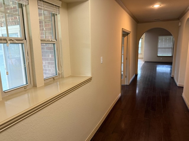 4315 Sanctuary Hills Ct, Spring, TX 77388 - hallway featuring a wealth of natural light, baseboards, arched walkways, ornamental molding, and hardwood / wood-style flooring