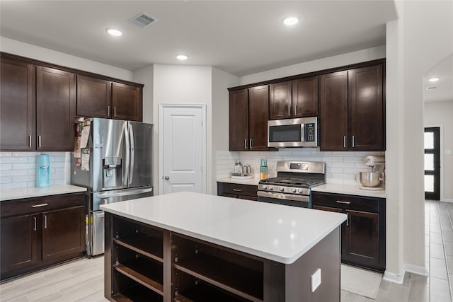 1226 Tilia Creek Ln, Montgomery, TX 77316 - kitchen featuring stainless steel appliances, open shelves, dark brown cabinetry, and recessed lighting