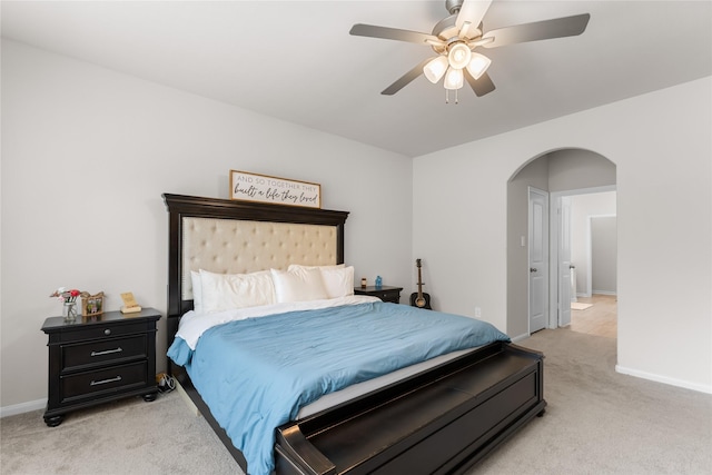 1226 Tilia Creek Ln, Montgomery, TX 77316 - bedroom with light carpet, arched walkways, baseboards, and a ceiling fan
