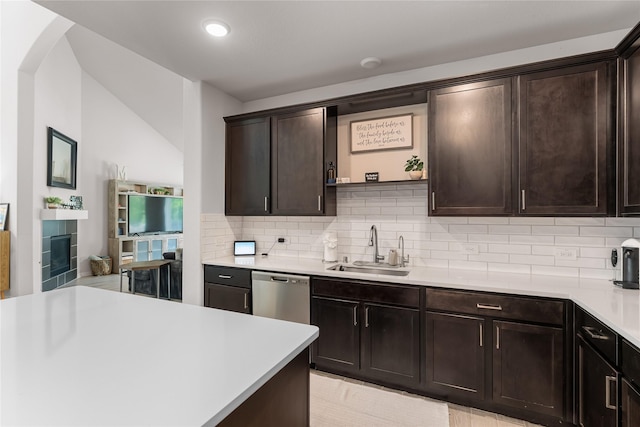 1226 Tilia Creek Ln, Montgomery, TX 77316 - kitchen with a sink, tasteful backsplash, light countertops, dishwasher, and dark brown cabinets