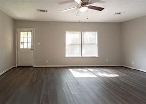unfurnished living room with baseboards, ceiling fan, and wood finished floors