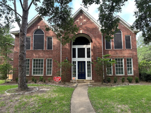 2627 Double Lake Dr, Missouri City, TX 77459 - view of front of home with a front yard and brick siding