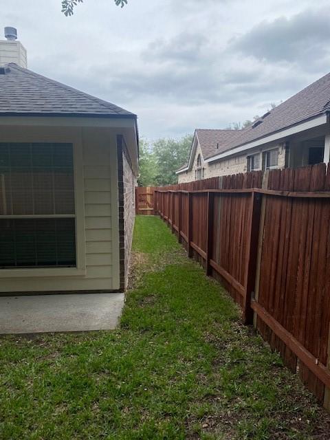 view of yard with a fenced backyard
