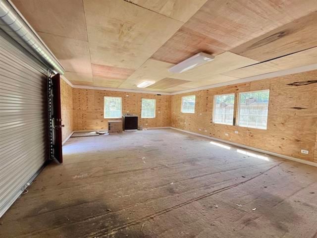 unfurnished living room featuring baseboards