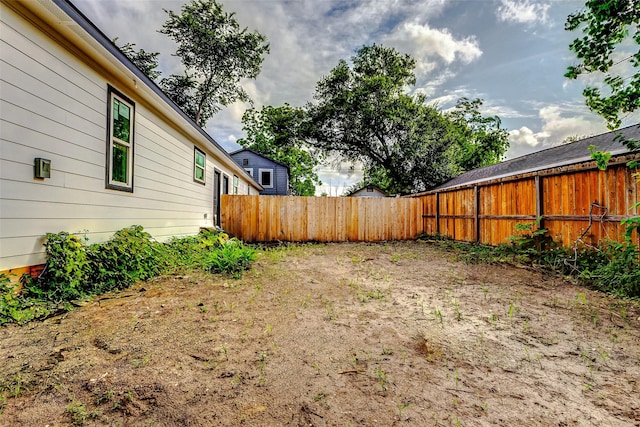 view of yard with a fenced backyard