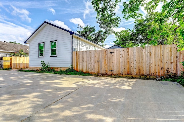 view of side of property with fence