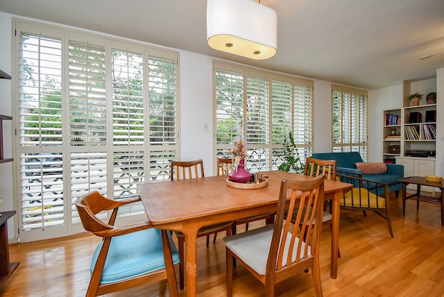 dining area with light wood-style flooring