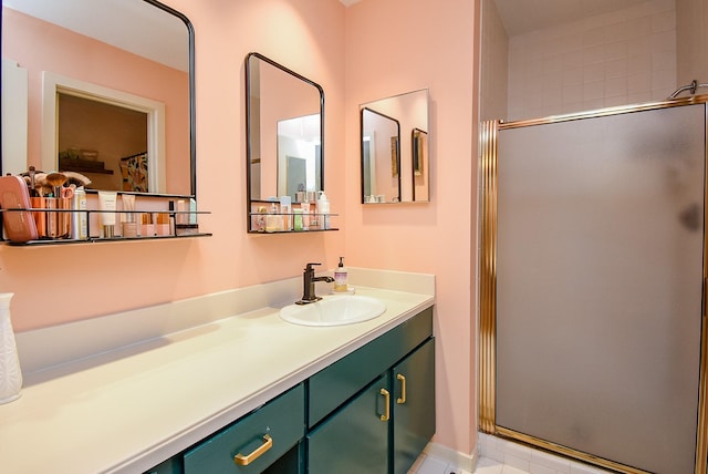 bathroom featuring a shower stall and vanity