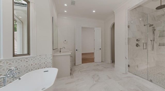 full bath featuring a marble finish shower, a freestanding bath, crown molding, visible vents, and vanity
