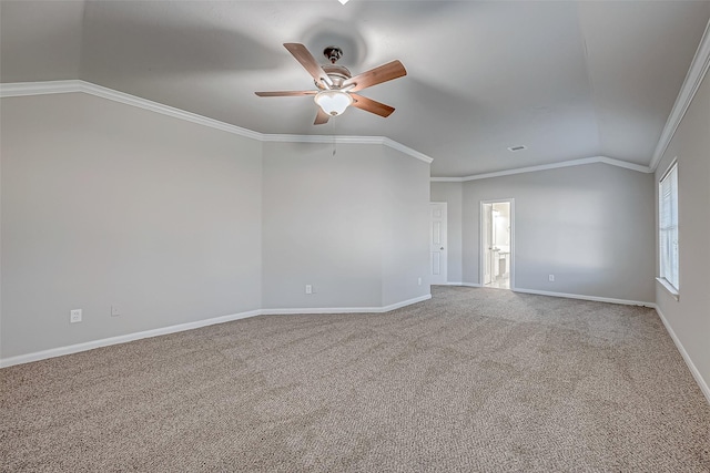 carpeted spare room with a ceiling fan, ornamental molding, lofted ceiling, and baseboards