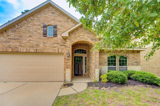 22526 Forbes Field Trl, Spring, TX 77389 - traditional home with concrete driveway, brick siding, a garage, and stone siding
