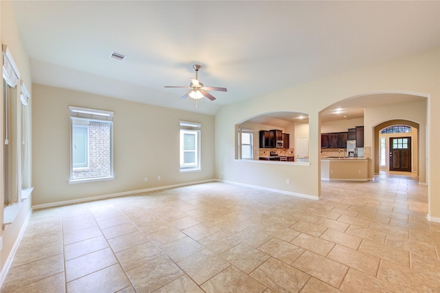 22526 Forbes Field Trl, Spring, TX 77389 - unfurnished living room featuring baseboards, a ceiling fan, visible vents, and stone tile flooring