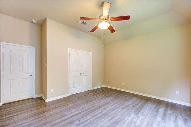 22526 Forbes Field Trl, Spring, TX 77389 - unfurnished bedroom with wood finished floors, a closet, visible vents, baseboards, and vaulted ceiling