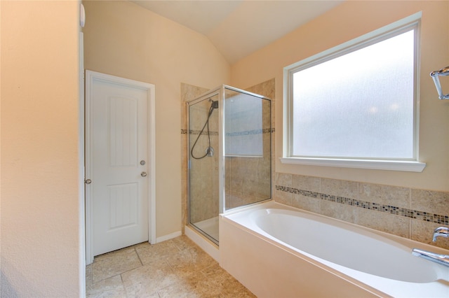 22526 Forbes Field Trl, Spring, TX 77389 - full bath featuring a stall shower, lofted ceiling, a bath, and tile patterned floors