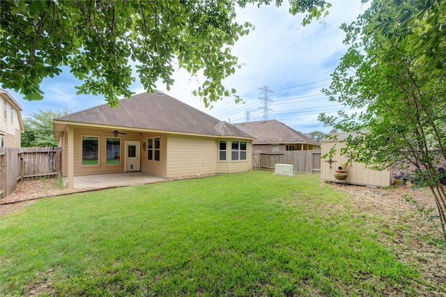 22526 Forbes Field Trl, Spring, TX 77389 - rear view of property with a yard, a patio, ceiling fan, a storage shed, and a fenced backyard