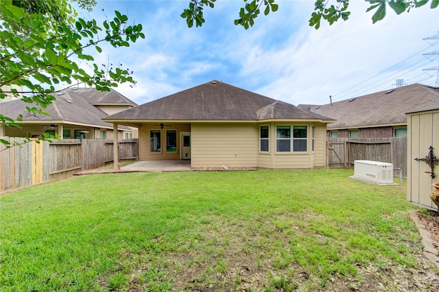22526 Forbes Field Trl, Spring, TX 77389 - back of property with a yard, a patio, ceiling fan, and a fenced backyard