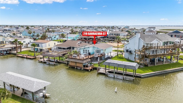 aerial view with a water view and a residential view