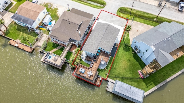 bird's eye view featuring a water view and a residential view
