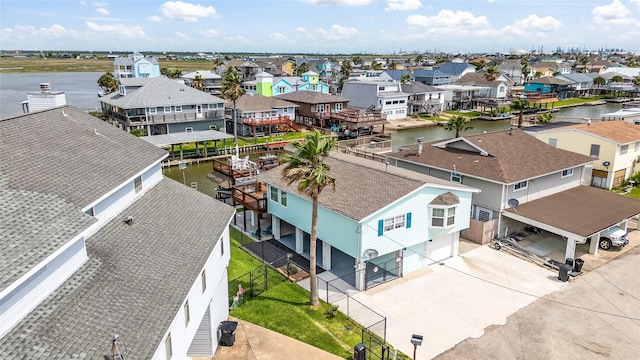 bird's eye view with a water view and a residential view